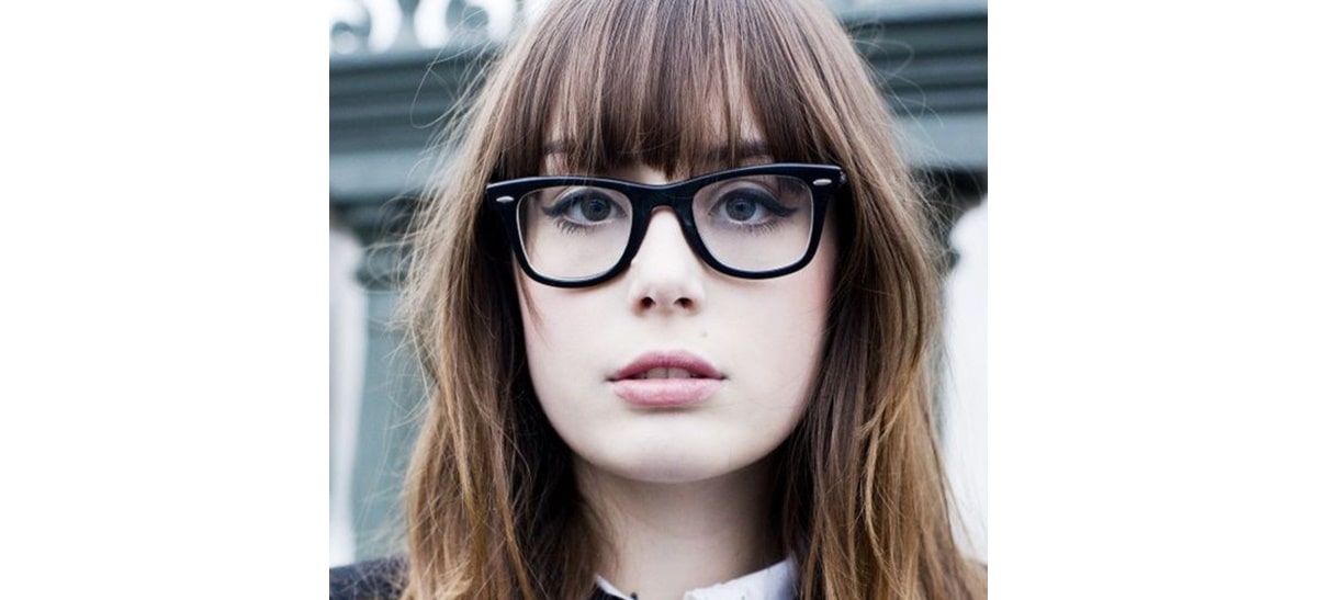 Image of Blunt bangs oval face hairstyle with glasses