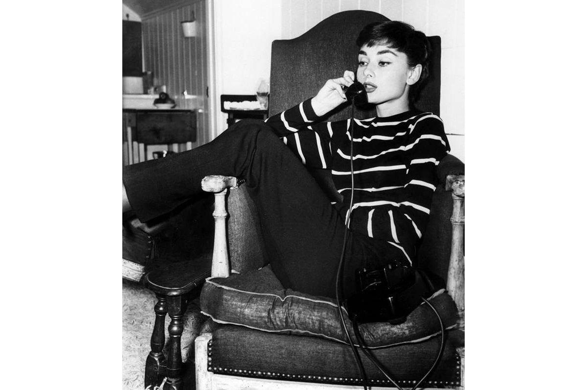 Image of Audrey Hepburn checking a bag
